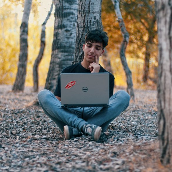 man using Dell laptop